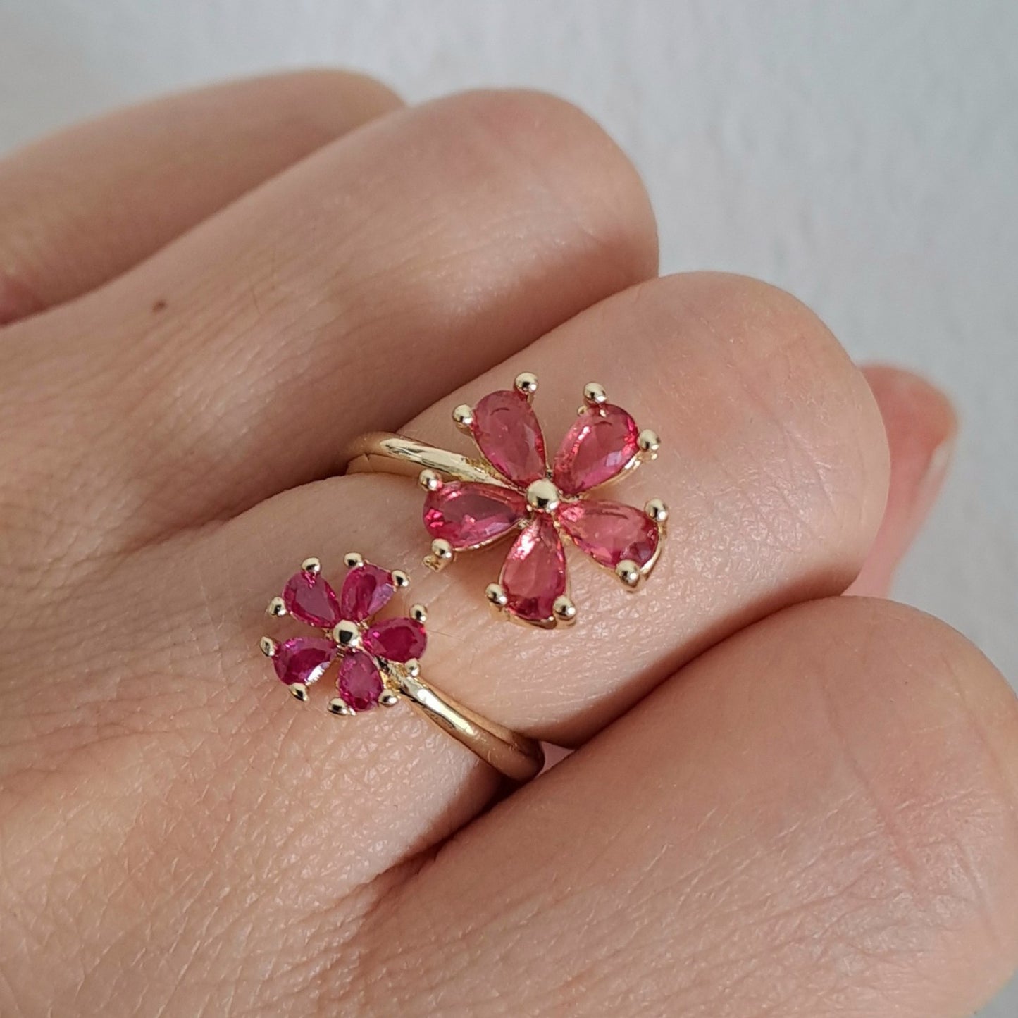 Gold plated brass open ring embedded with pink zircons/flower design